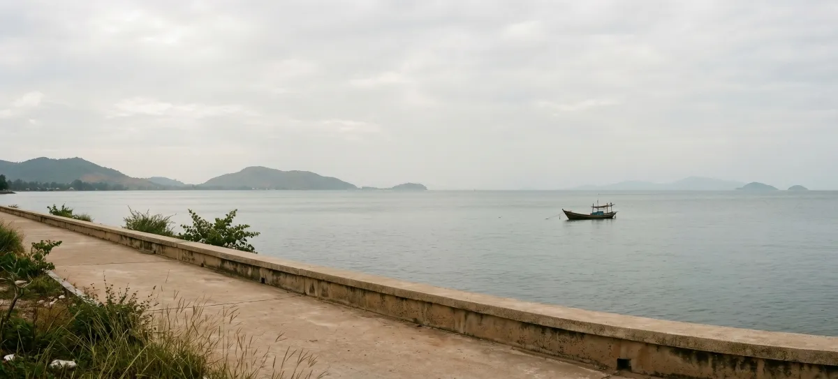 A view across the Gulf of Thailand from the Kep coastline, a single fishing boat in the distance